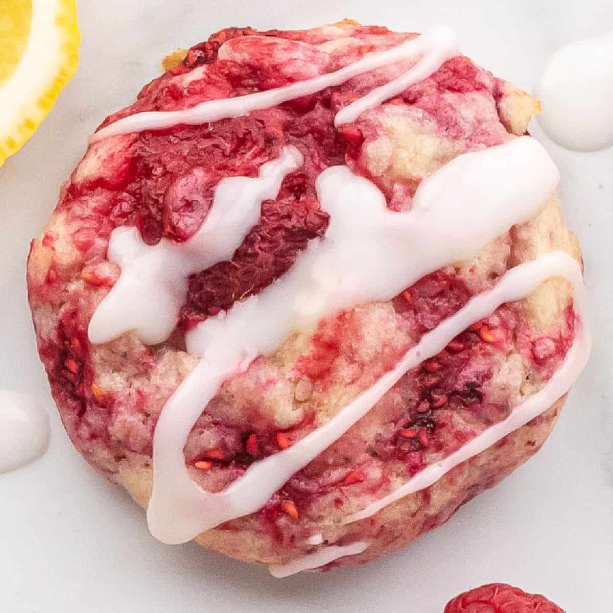 square close up image of a raspberry lemon cookie drizzle with glaze