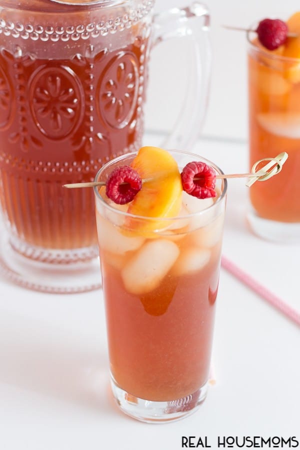 This sweet and fruity RASPBERRY PEACH ICED TEA is sure to be a summer staple! Simple black tea gets spruced up with an infused syrup using fresh peaches and raspberries!