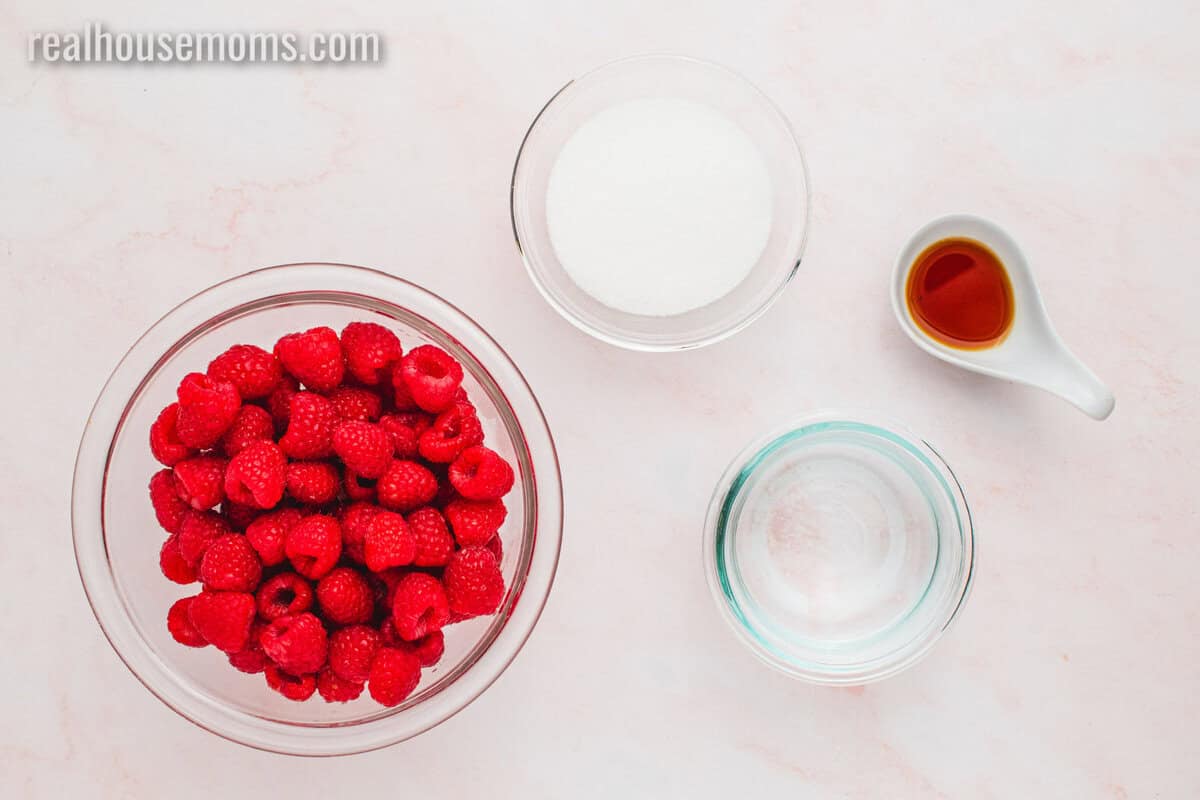 looking down at ingredients to make raspberry syrup on a counter