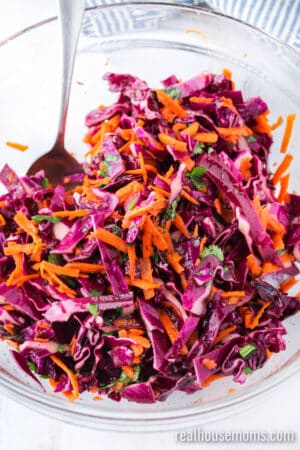 red cabbage slaw after mixing in a bowl