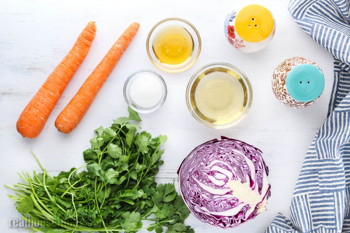 ingredients to make red cabbage slaw laid out on a table