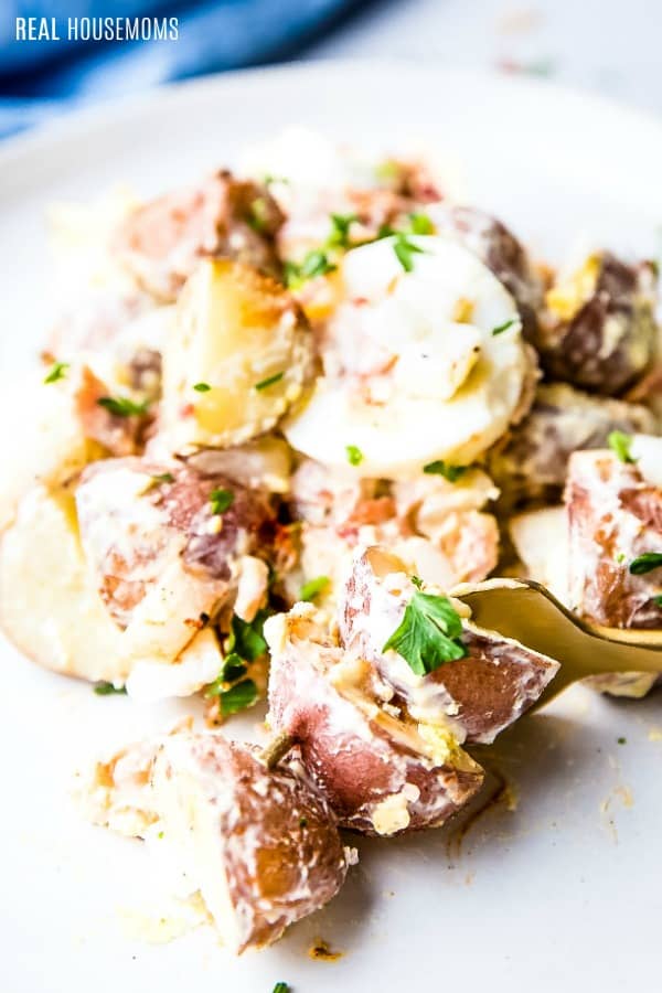 close up of red potato salad on a plate