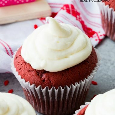 close up of red velvet cupcake with cream cheese frosting