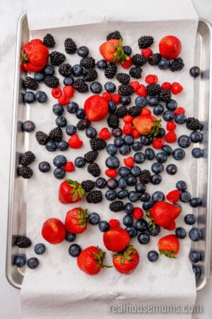 fresh berries on a baking sheet pined with paper towels