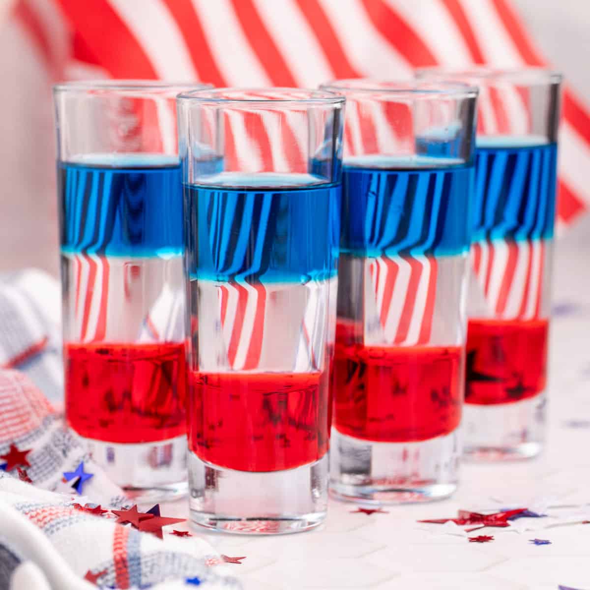 square image of red white and blue shooters in front of an american flag