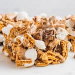 square image of a reese's peanut butter cup s'mores bars on a marble platter