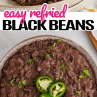 top picture of refried black beans in a serving bowl topped with jalapeno and cilantro, bottom picture is over the top shot of refried black beans in a white bowl with jalapeños and cilantro for garnish. In the middle of the two pictures is the title of the post in pink and black lettering