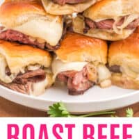 roast beef horseradish cheddar sliders stacked on a plate with recipe name at the bottom