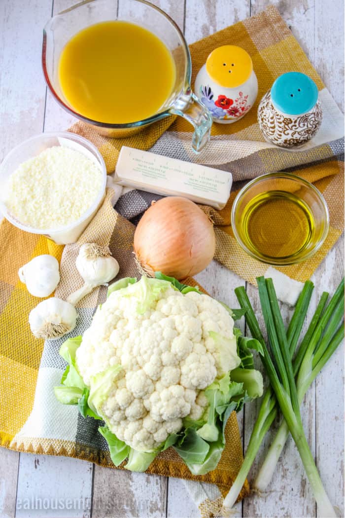 ingredients to make roasted garlic & cauliflower soup laid out on a towel