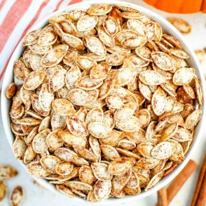 An easy recipe for crunchy and flavorful Roasted Pumpkin Seeds. Use your favorite sweet or savory spices to make these just the way you want them!