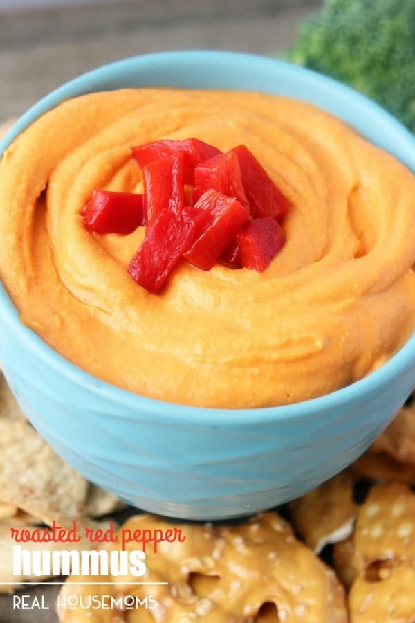 You'll never buy hummus again after you try this homemade ROASTED RED PEPPER HUMMUS! It is creamy and flavorful and tastes amazing with a handful of vegetables, pita chips, or pretzels.