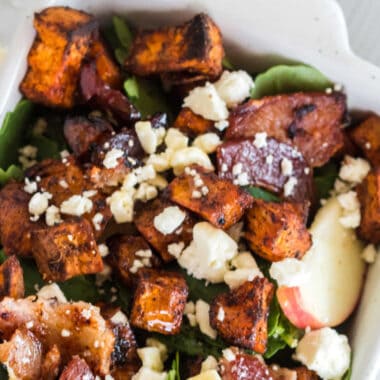 Close up of Roasted Sweet Potato salad in a white serving dish