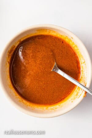 avocado oil and curry paste mixed together in a small bowl