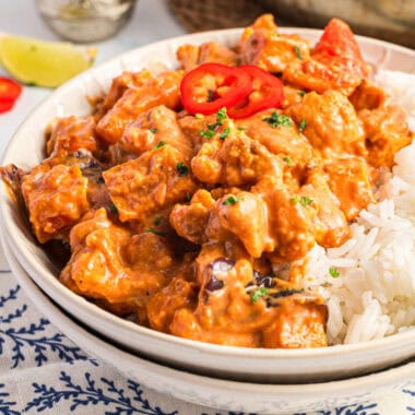 square image of roasted vegetable curry and rice in a bowl