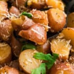 square close up image of rosemary & garlic instant pot potatoes on a spoon