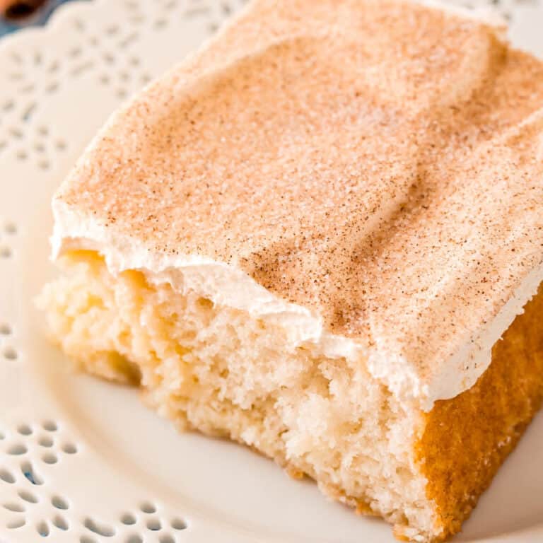 square image looking down at a slice of RumChata poke cake on a plate