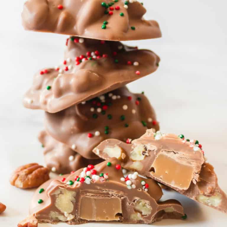 Slow Cooker Chocolate Turtles are the easiest homemade candy! With only 5 ingredients and your trusted slow cooker, you'll love making this fun candy recipe!