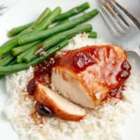Sweet cranberry and tangy BBQ sauce give plain chicken breasts a sweet & savory spin that's hard to resist! Slow Cooker Cranberry Chicken is a crockpot win!