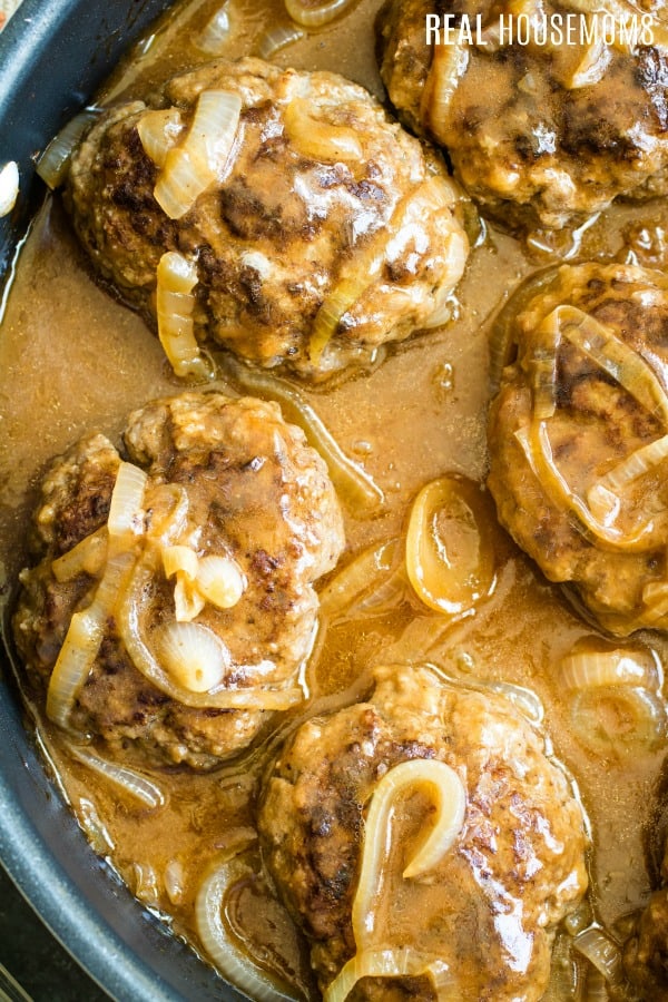 skillet of salisbury steak with onions and gravy