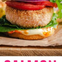 salmon burger on a cutting board with recipe name at the bottom