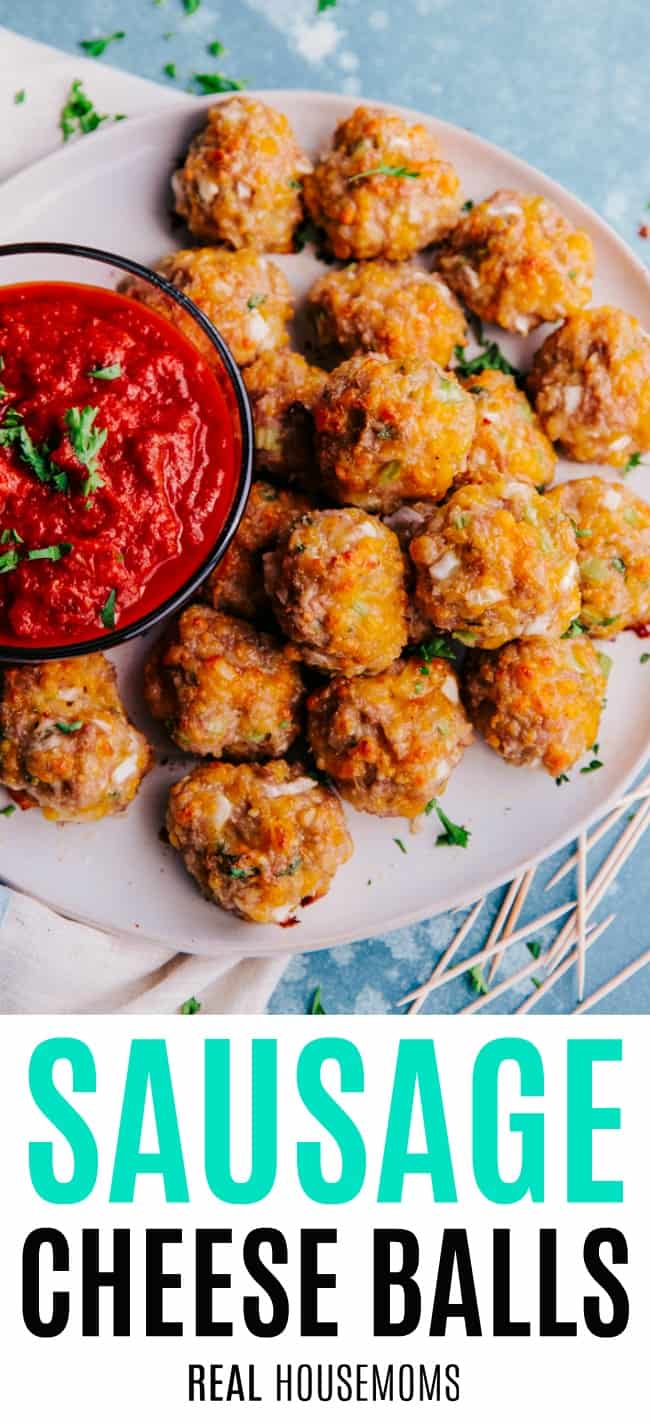 sausage cheese balls on a serving platter with a bowl or marinara for dipping