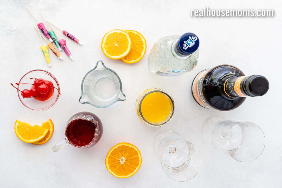 ingredients to make a se on the beach drink and glassware on a counter