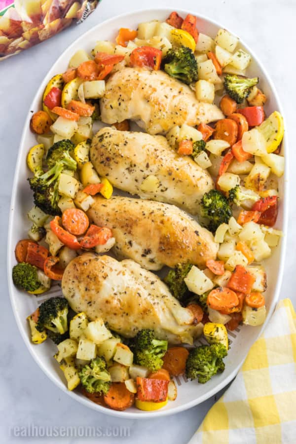 sheet pan chicken and veggies on a platter