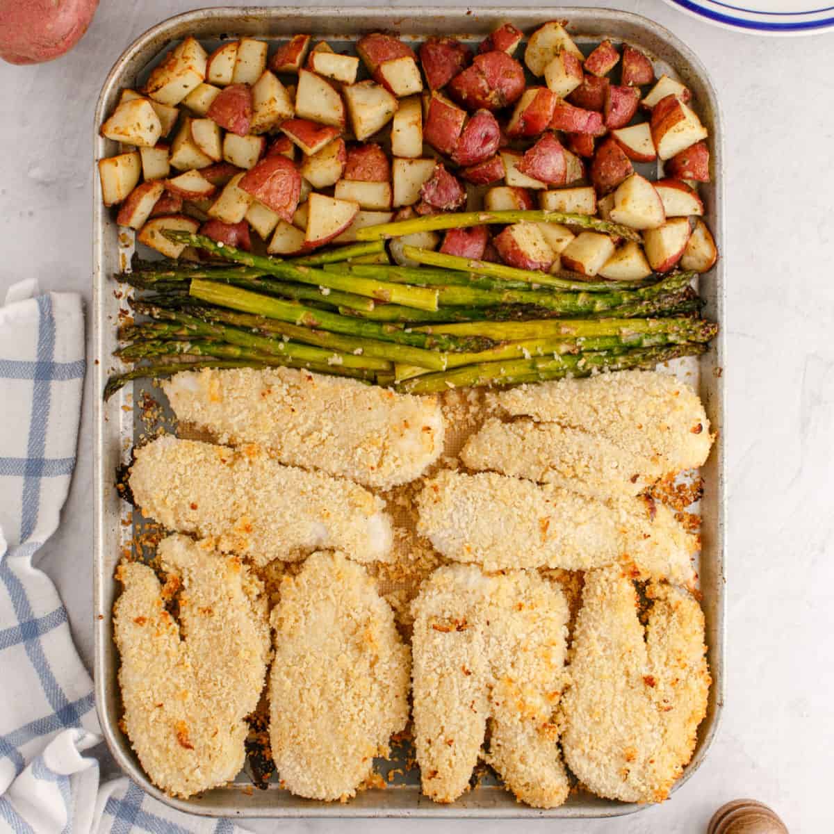 square image of sheet pan ranch chicken dinner on the baking sheet