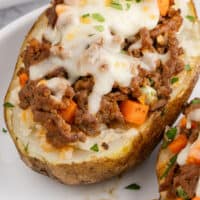 shepherd's pie baked potato on a plate with recipe name at the bottom