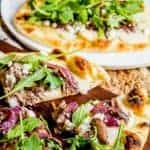 This Short Rib Naan Pizza is an easy dinner recipe made with tender beef short ribs, a creamy béchamel , and a crisp naan crust!