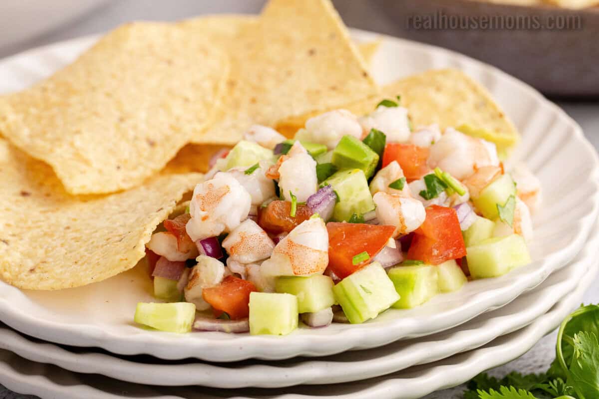 shrimp ceviche on a plate with tortilla chips