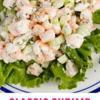 shrimp salad served over lettuce with recipe name at the bottom