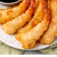 shrimp tempura piled on a plate with recipe name at the bottom