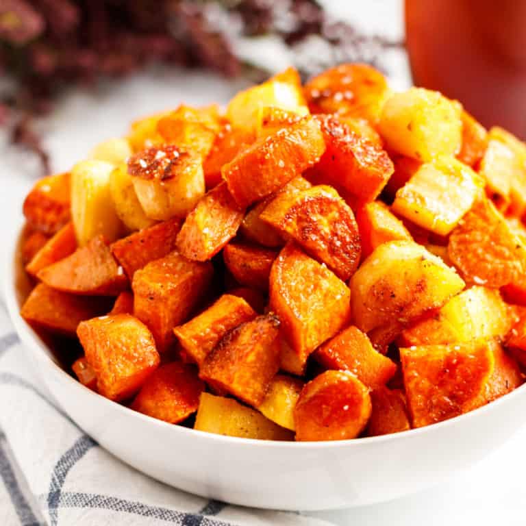 square image of oven roasted vegetables in a bowl