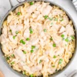 square image of creamy chicken noodle casserole in a skillet