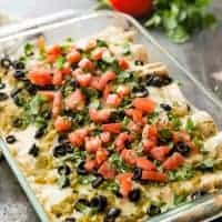 These Skinny Creamy Chicken Enchiladas are so full of flavor that no one will know that they're skinny! You can even make a double batch and freeze one for later. It's the perfect make-ahead family meal!