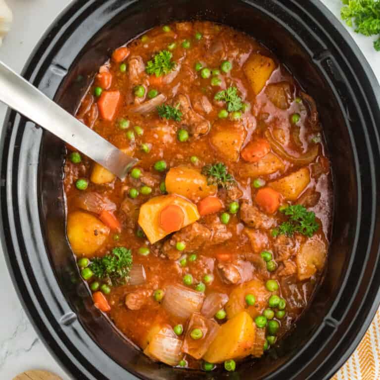 square image of slow cooker beef stew in a crock pot