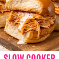 picture of one slow cooker buffalo chicken slider on a wood cutting board