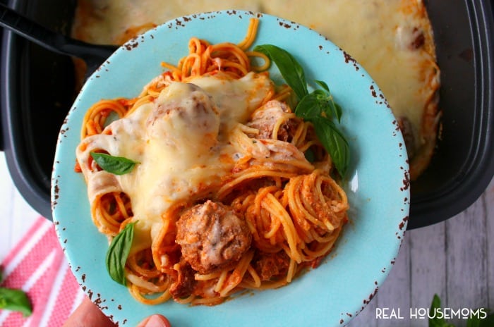 If your family loves spaghetti and meatballs, then you've gotta try this easy, slow cooker version! Loaded with Italian meatballs, ricotta and mozzarella cheeses, this easy SLOW COOKER CHEESY SPAGHETTI AND MEATBALLS recipe is a fantastic dinner option