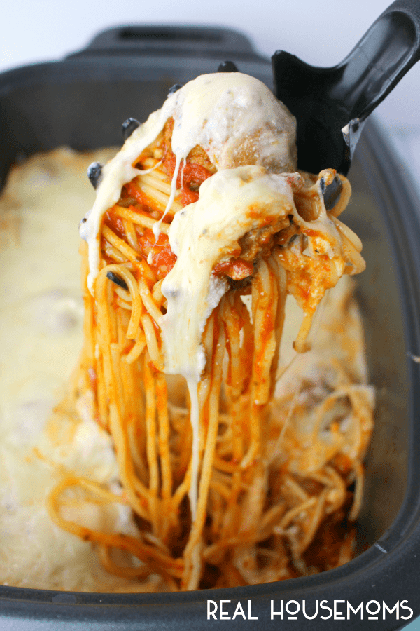 If your family loves spaghetti and meatballs, then you've gotta try this easy, slow cooker version! Loaded with Italian meatballs, ricotta and mozzarella cheeses, this easy SLOW COOKER CHEESY SPAGHETTI AND MEATBALLS recipe is a fantastic dinner option 