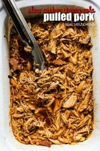 Juicy and tender Slow Cooker Cherry Cola Pulled Pork is the perfect set it and forget it Summer crockpot recipe. Serve over rice or on a bun topped with your favorite BBQ sauce!