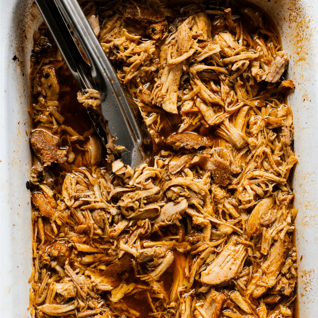 Juicy and tender Slow Cooker Cherry Cola Pulled Pork is the perfect set it and forget it Summer crockpot recipe. Serve over rice or on a bun topped with your favorite BBQ sauce!