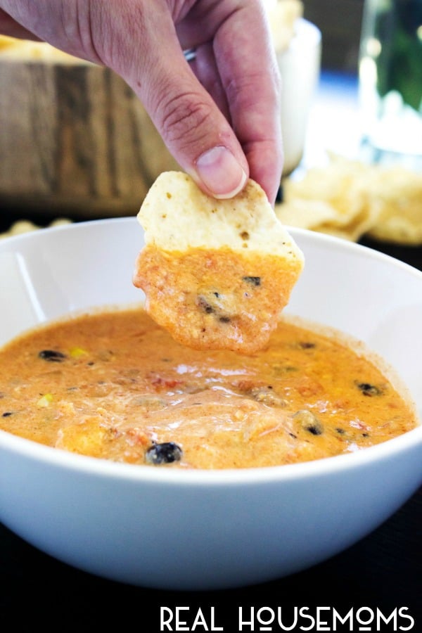 SLOW COOKER CHICKEN CHILI DIP a cheesy chili dip with all the flavors of a fiesta right in your mouth. This recipe makes a large batch, so it's a great dish to serve for your next party!