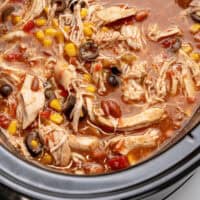 slow cooker chicken taco soup in a crock pot with recipe name at the bottom