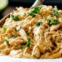 SLOW COOKER CHIPOTLE RANCH CHICKEN is juicy perfection that's a staple everyone needs in their back pocket! Incredibly versatile, flavorful chicken for tacos, burritos, nachos, soups, salads, etc. and all you do is dump and run!