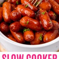 slow cooker honey garlic lil' smokies in a bowl with a fork with recipe name at the bottom
