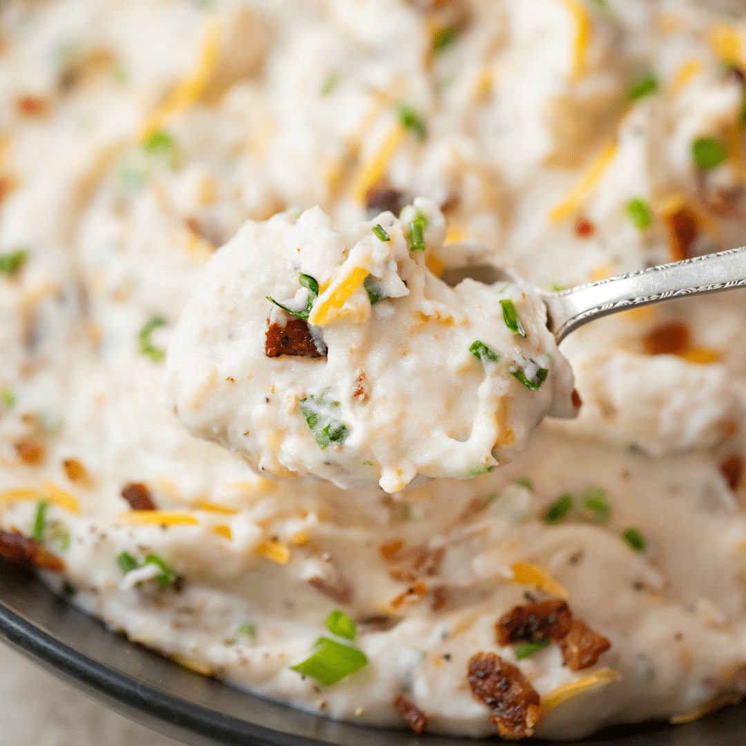 Slow Cooker Loaded Mashed Potatoes are the easiest side dish you'll ever make! This recipe is great for every meal, from weeknight dinners to feeding your holiday crowd!