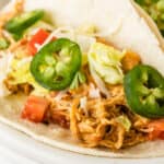 square close up of image of slow cooker queso chicken taco