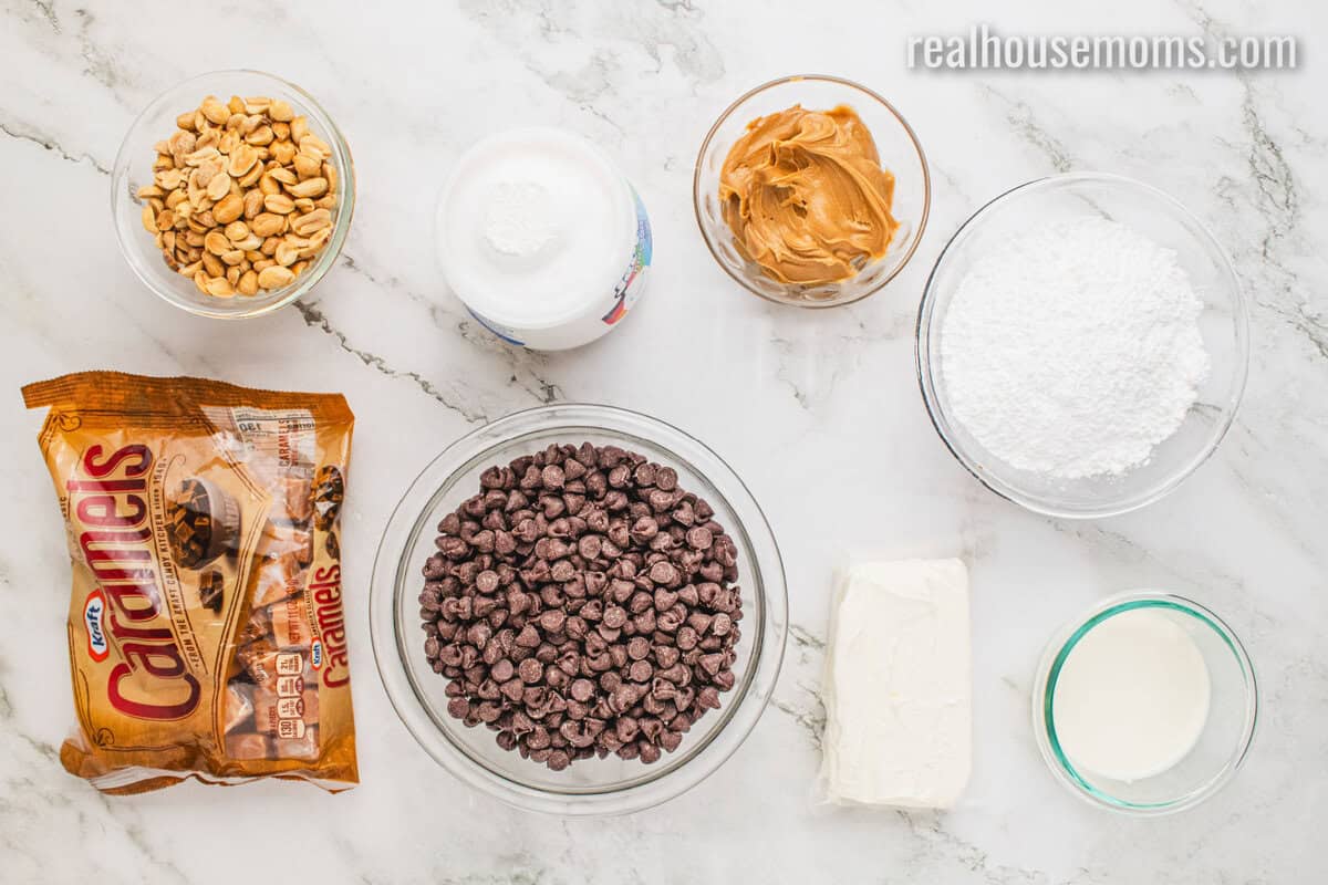 looking down at ingredients to make snickers cheesecake bars