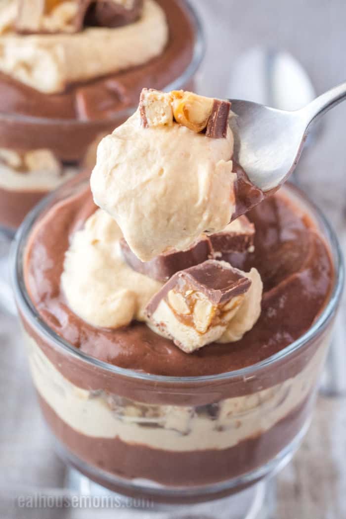 spoonful of Snickers chocolate parfait over a dessert cup